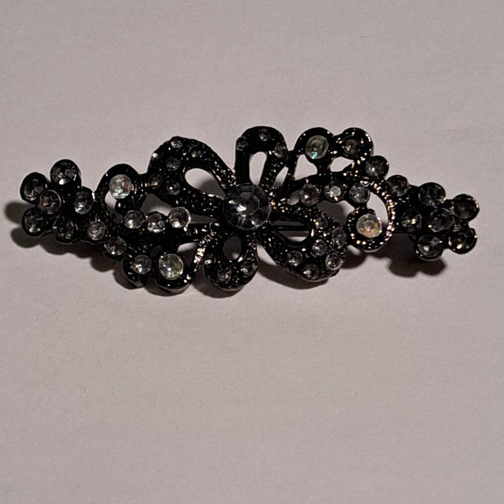 Flower design black or gun metal color  brooch with diamond like stones brooch
